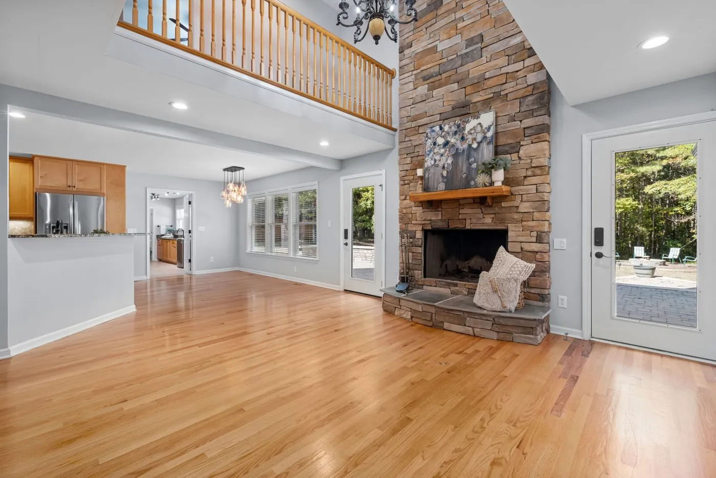 Stacked-stone fireplace with a wood mantel and stone hearth